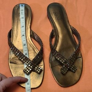 Leather  bronze copper thong sandals. Vary dainty. Love the little heel.